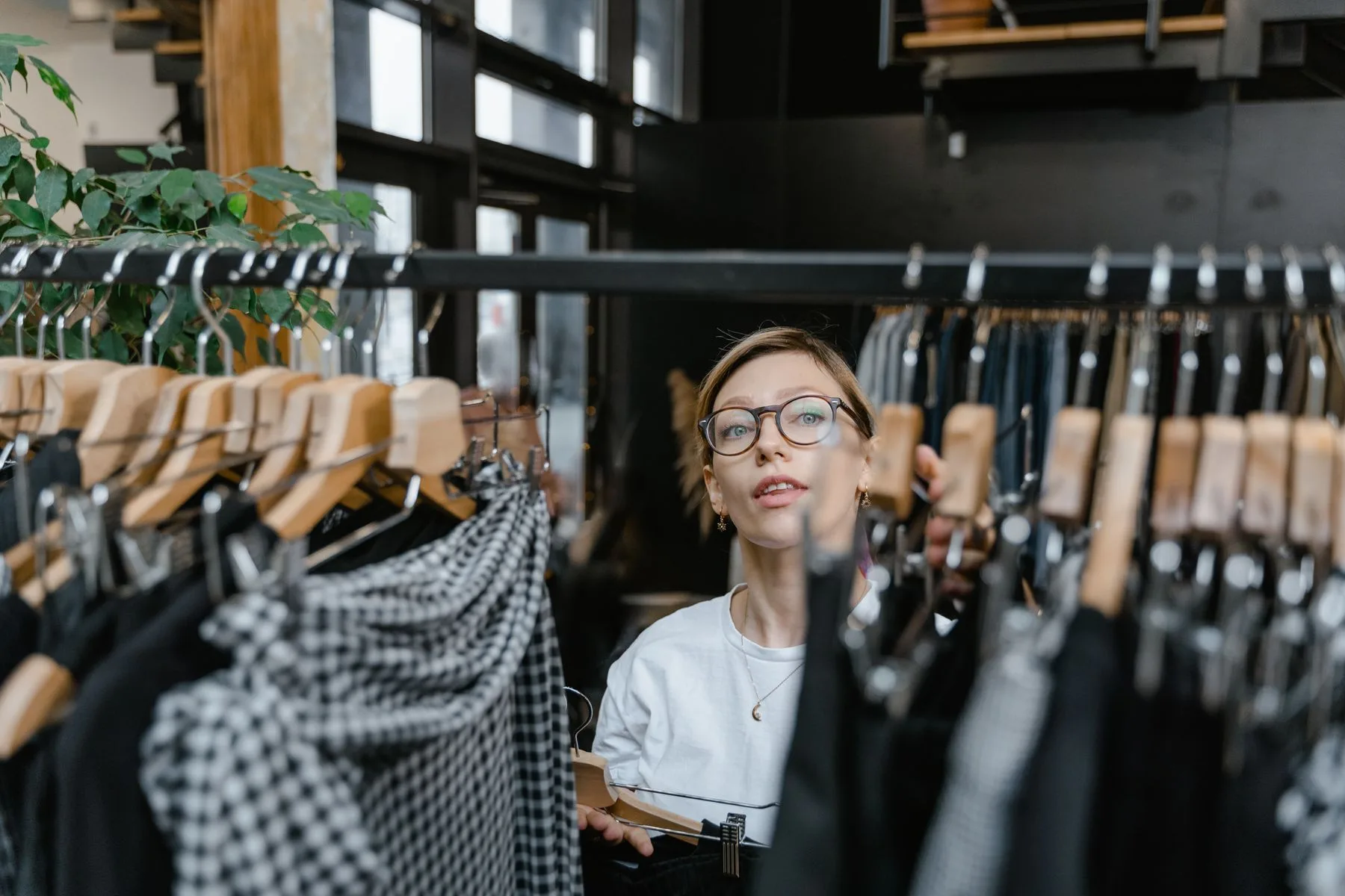 A curated clothing rack in a fashion studio